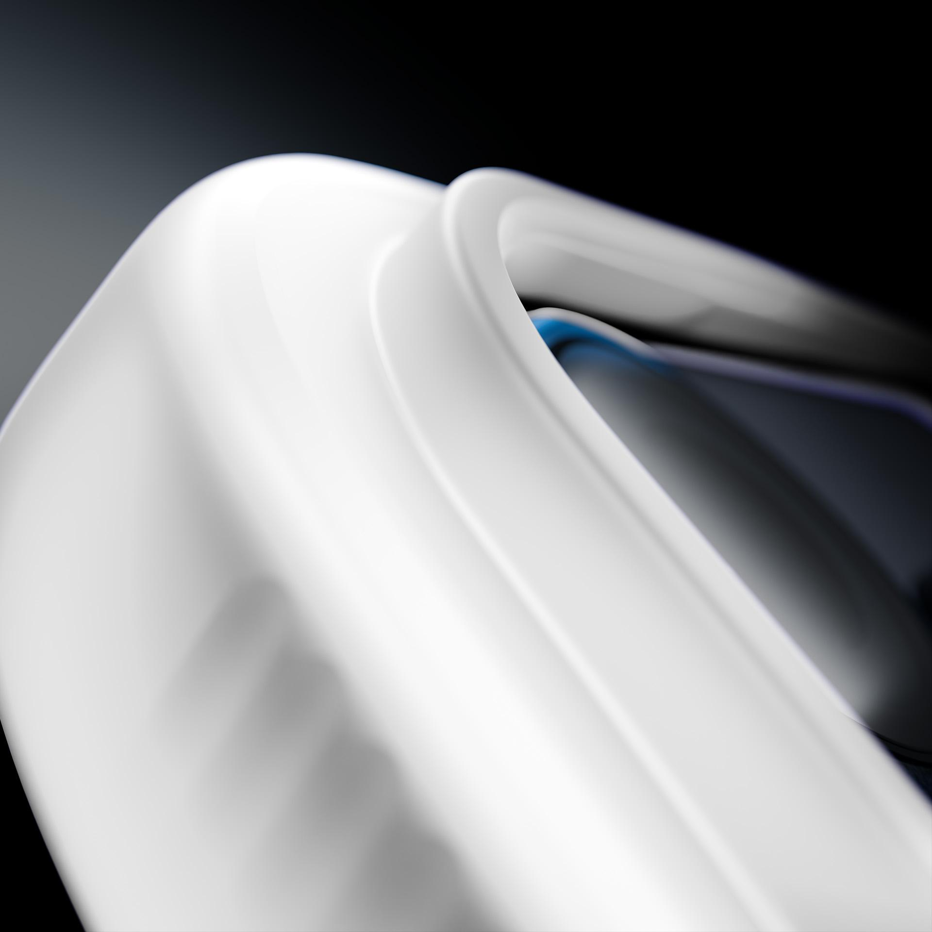 Abstrakcyjny zbliżenie białej, zakrzywionej formy z cieniami i niebieskimi akcentami.