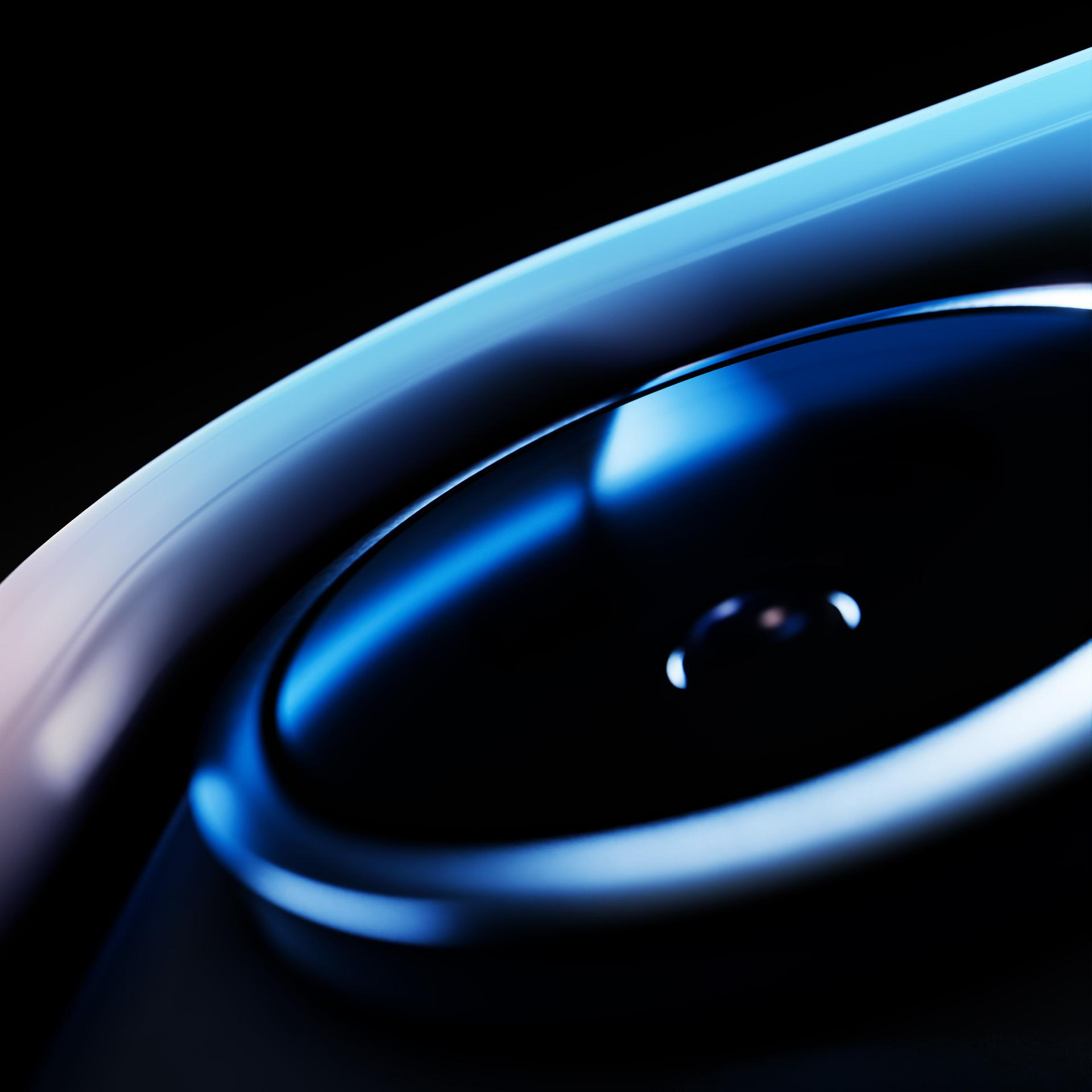 Abstrakcyjny zbliżenie gładkiej, niebieskiej powierzchni z refleksami świetlnymi.