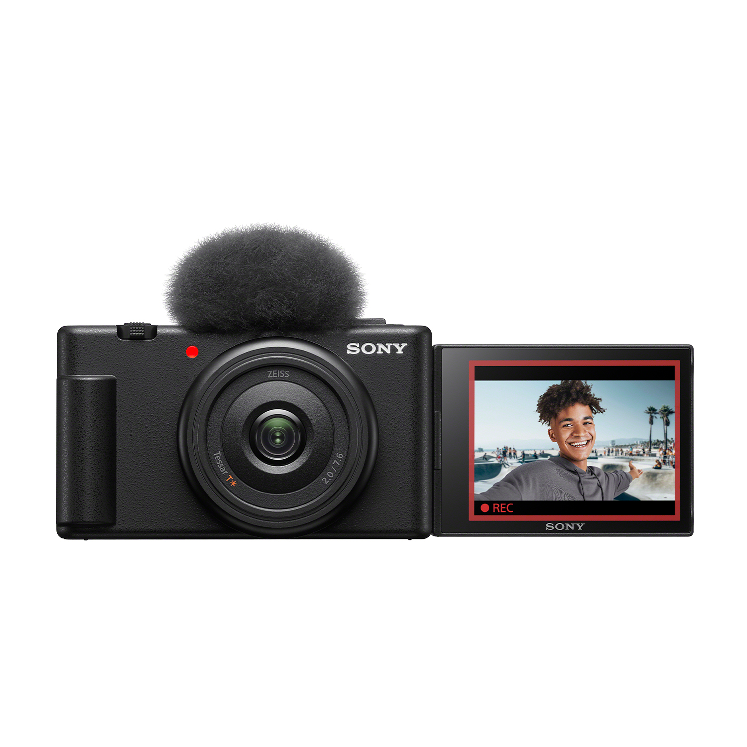 Schwarze Sony-Kamera mit Mikrofon und schwenkbarem Bildschirm, der einen lachenden Mann zeigt.