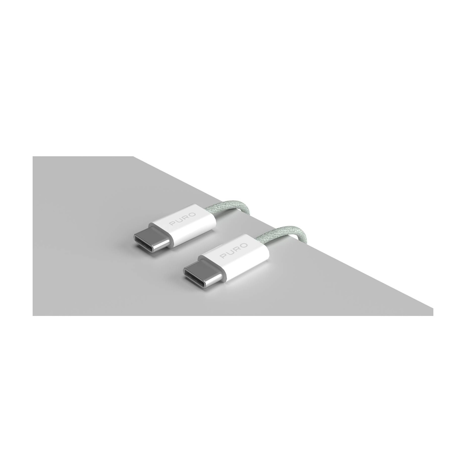 Twee witte Puro USB-C kabels met grijze vlechting liggen op een grijs oppervlak.