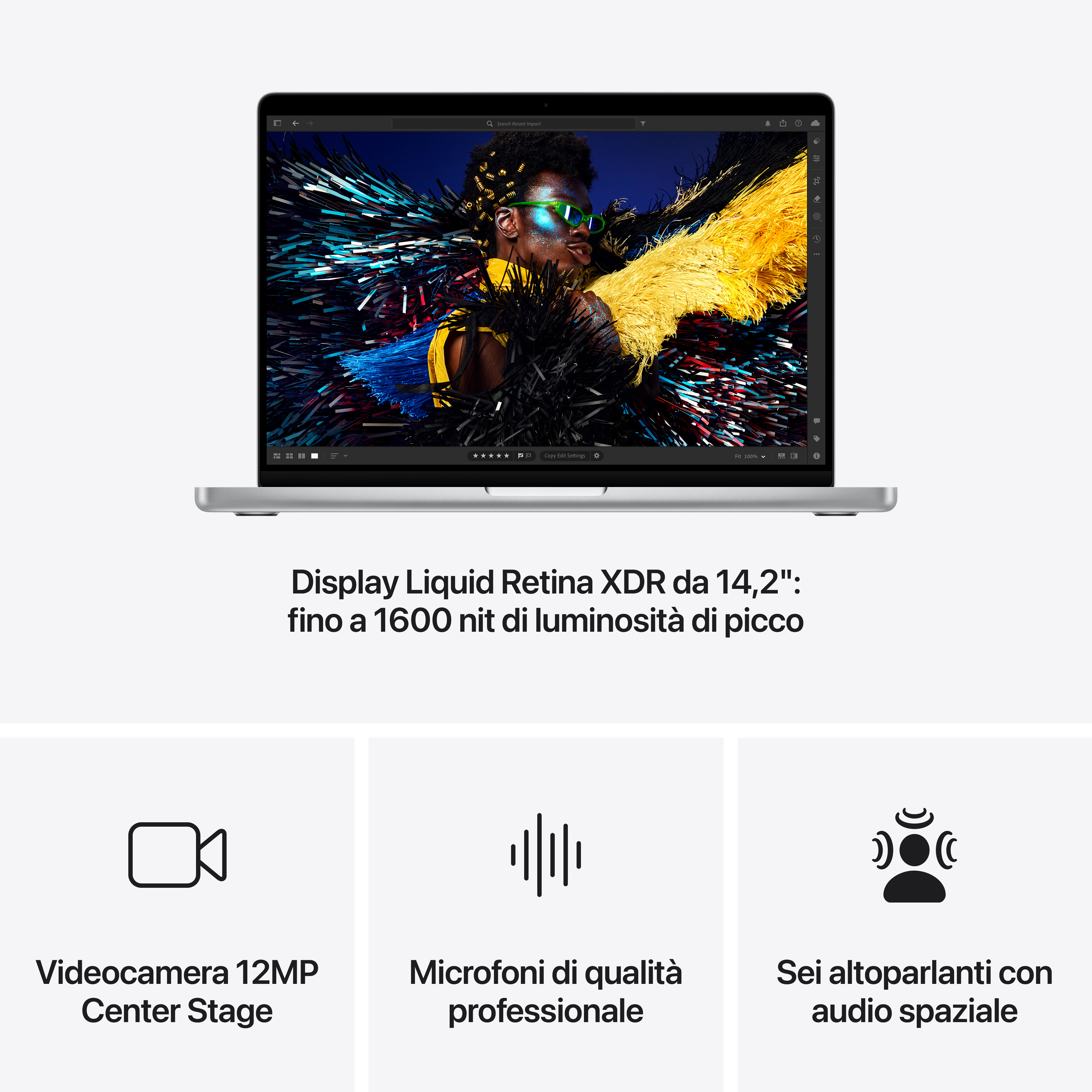 Un laptop mostra l'immagine di un uomo con piume colorate e occhiali.