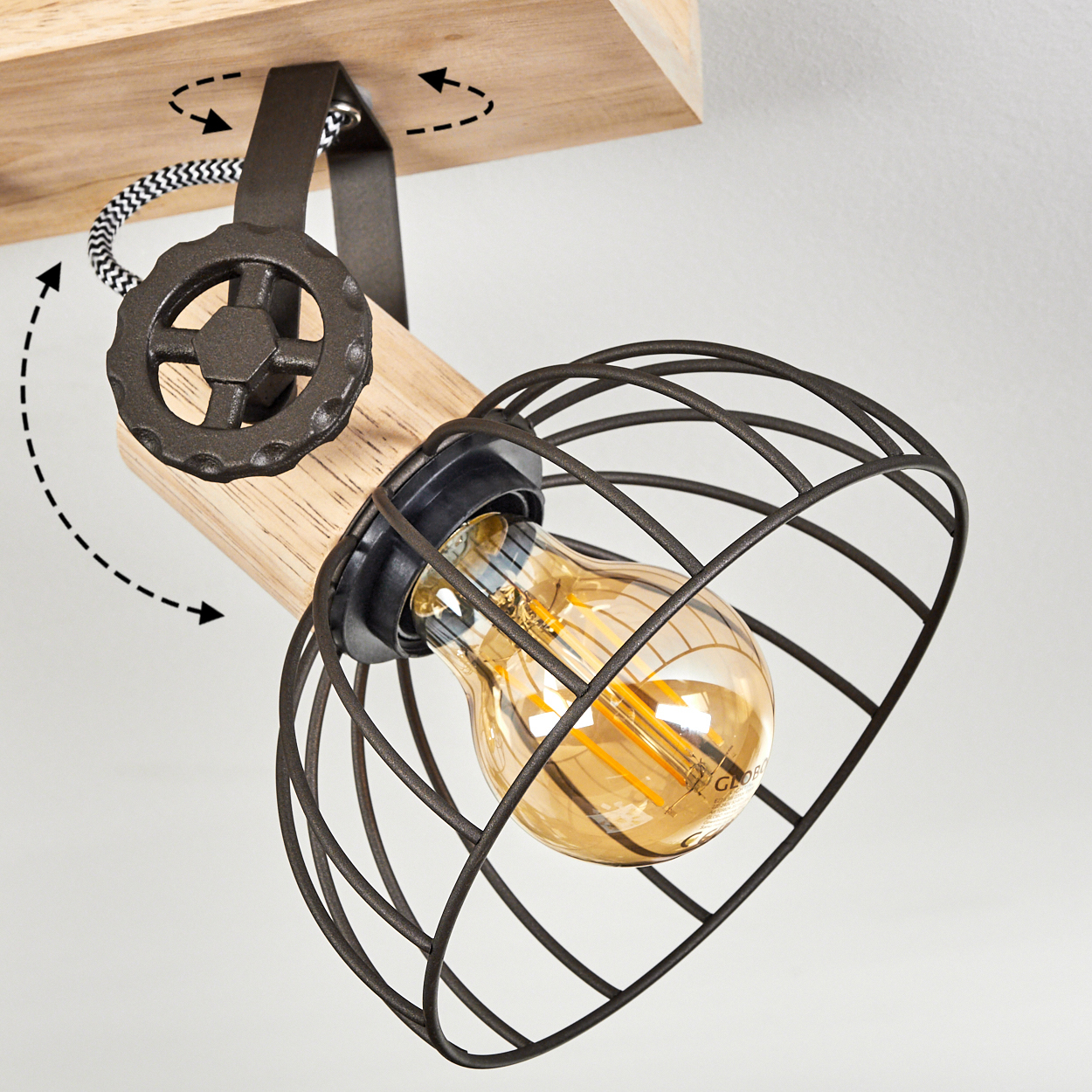 Eine industrielle Lampe mit Holzelement und schwarzem Metallkäfig.