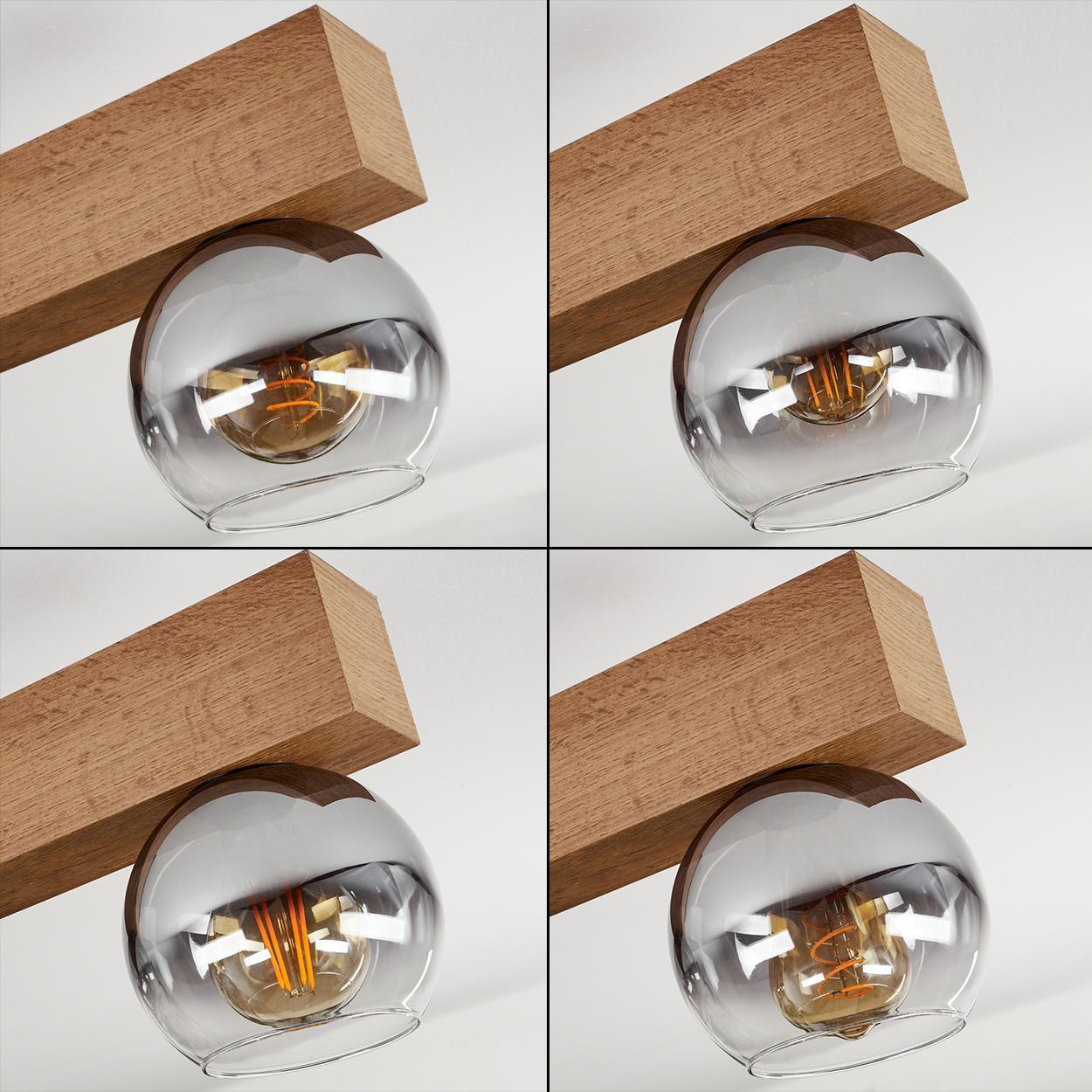 Holzbalken stützt eine rauchige Glaskugel mit sichtbarer Glühbirne.