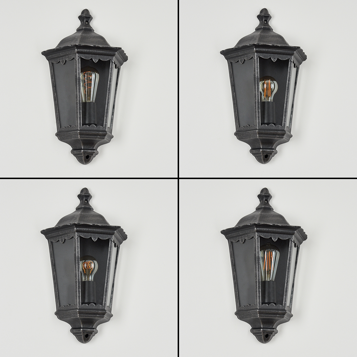 Vier Wandleuchten im Vintage-Stil mit sichtbaren Glühbirnen.