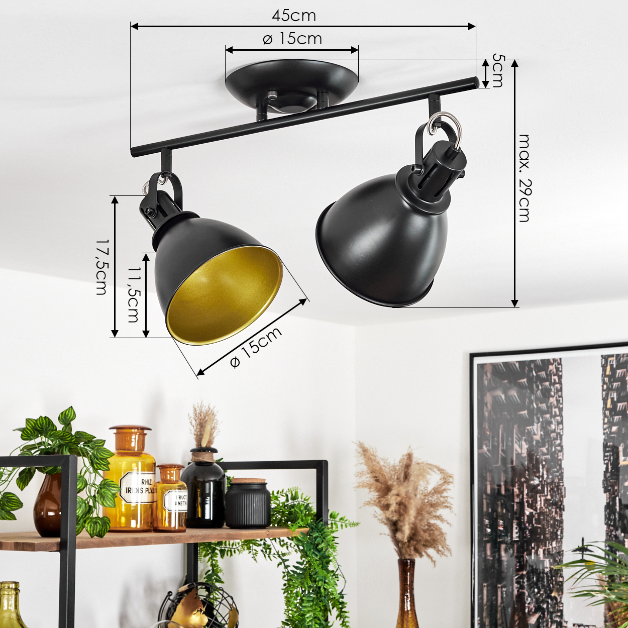 Schwarze Deckenleuchte mit zwei verstellbaren Spots und goldenen Innenseiten.