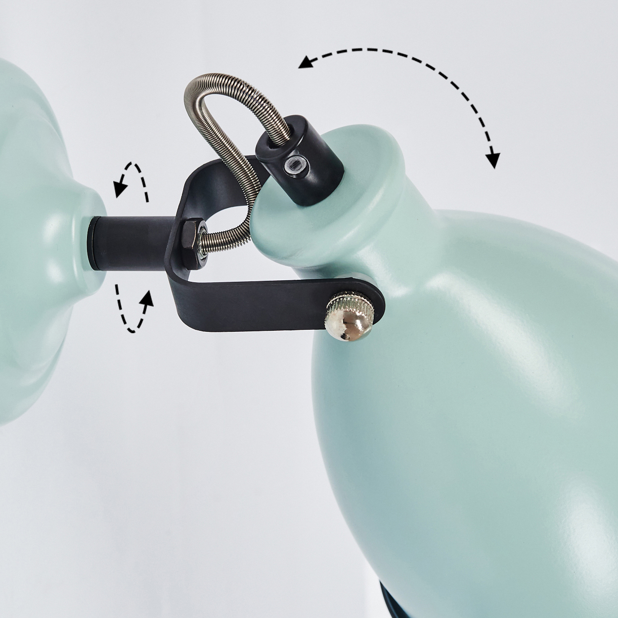 Hellgrüne Lampe mit flexiblen Gelenken und Federn, die Bewegung anzeigen.
