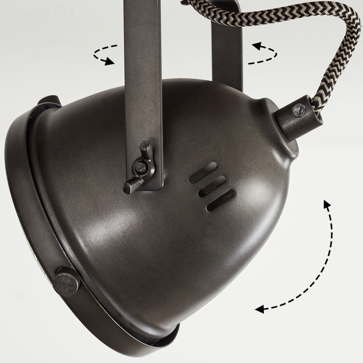 Eine schwenkbare dunkle Lampe mit einem gemusterten Kabel und Pfeilen, die Bewegung anzeigen.