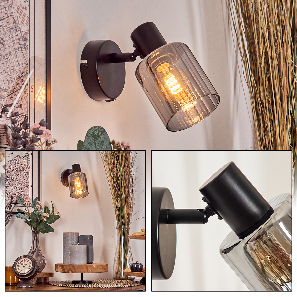 Eine schwarze Wandleuchte mit rauchglas Zylinder und sichtbarer Glühbirne.