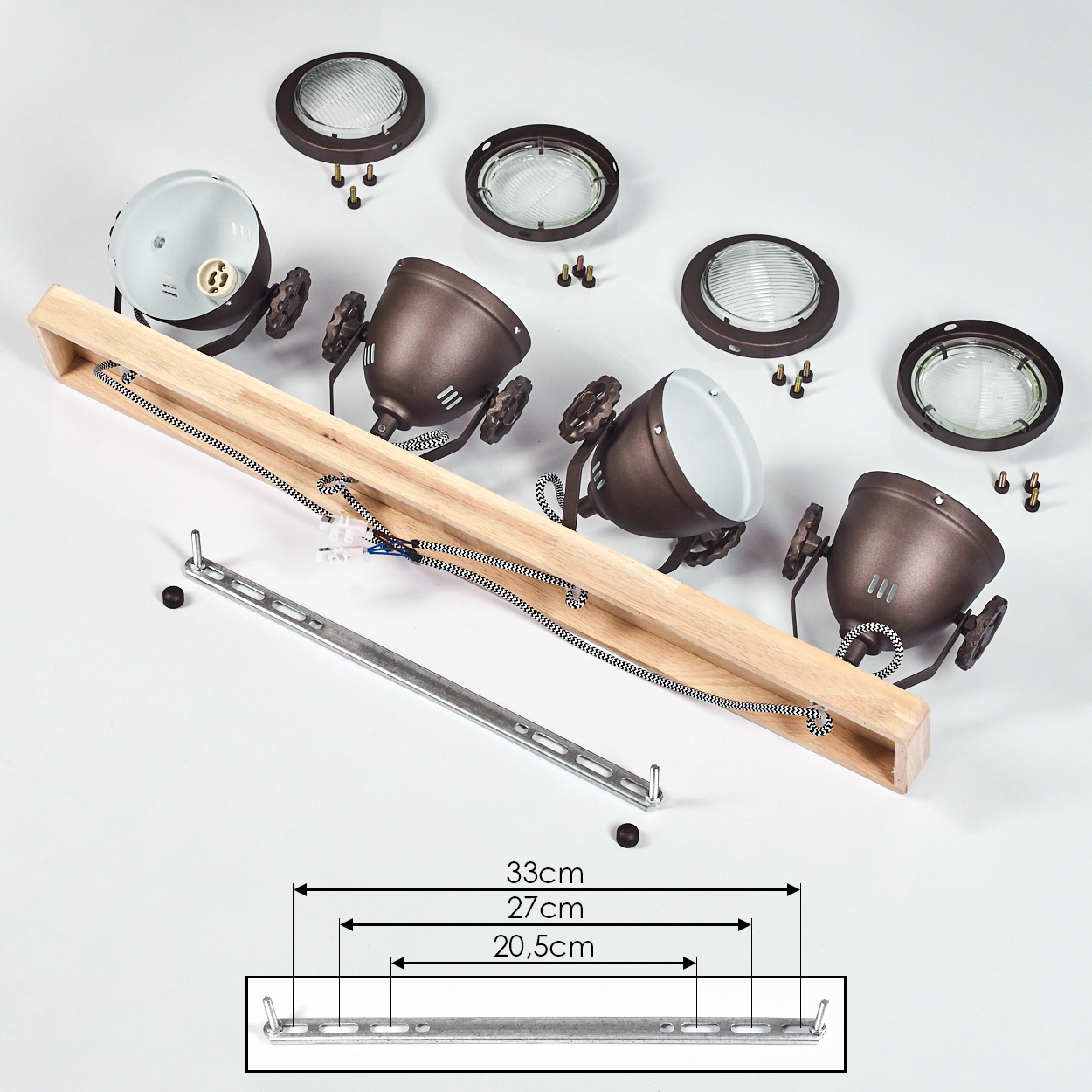 Teile einer braunen Lampe mit Holzsockel und Metallhalterung auf weißem Grund.