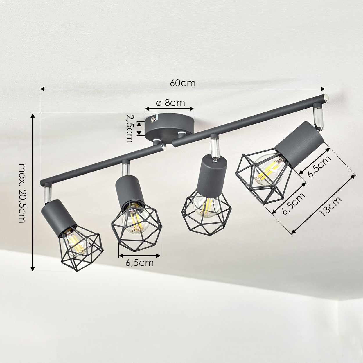Schwarzer Deckenstrahler mit vier verstellbaren Lampen und geometrischen Schirmen.