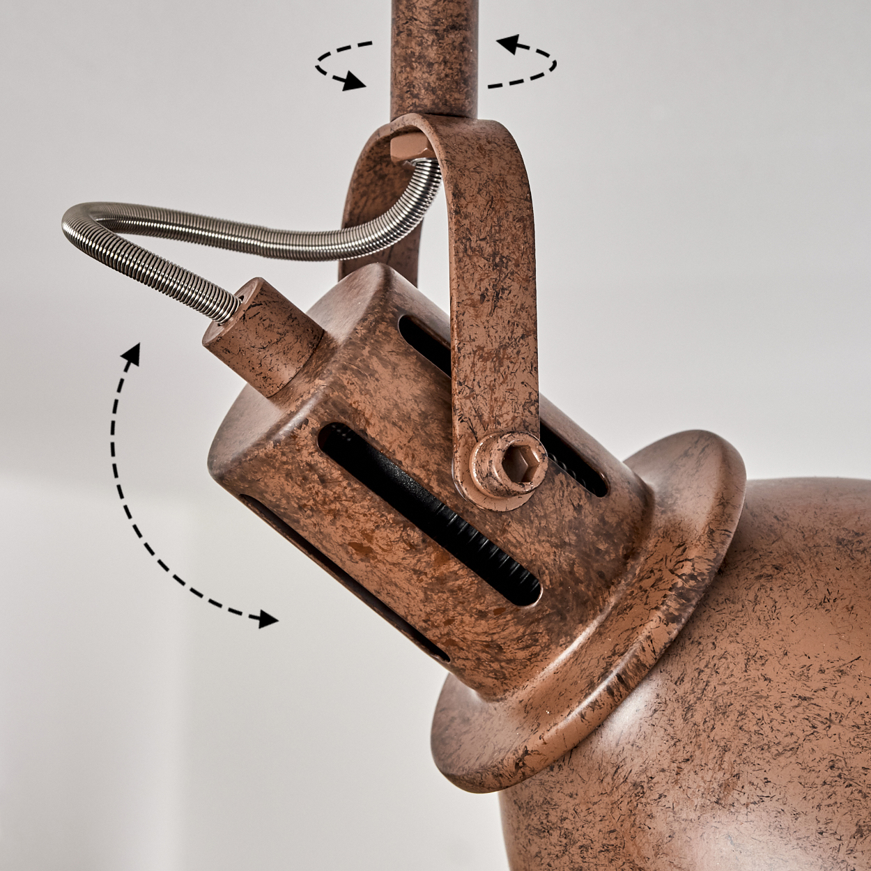 Brauner Lampenarm mit Scharniergelenk und Feder. Zeigt Verstellbarkeit.