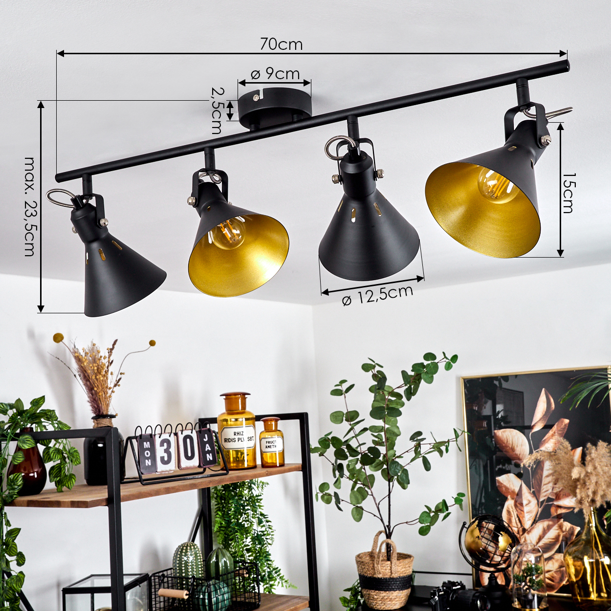 Schwarzer Deckenstrahler mit vier verstellbaren Lampen und goldenem Innenleben.