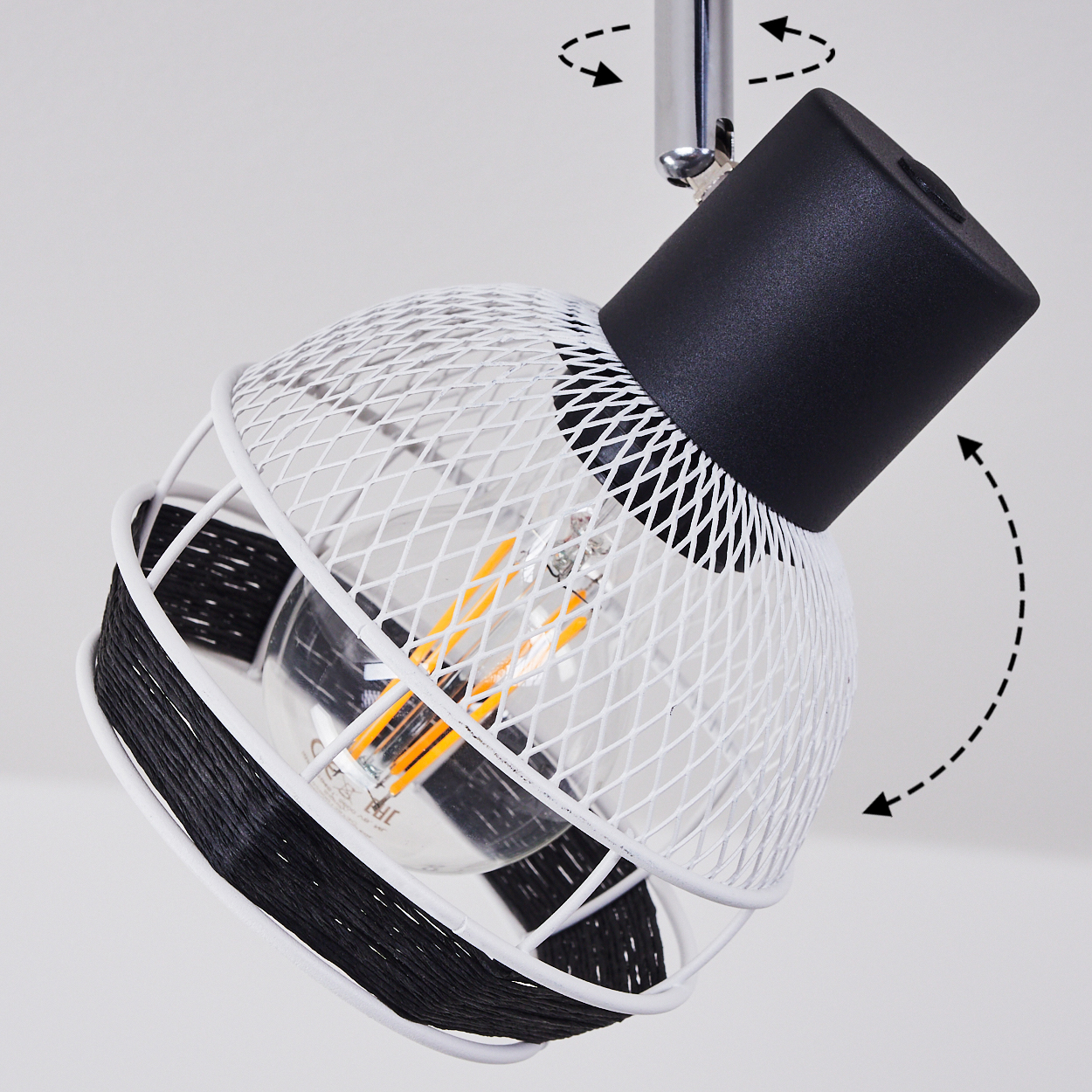 Eine weiße Drahtlampe mit schwarzer Schnur und einer Glühbirne.