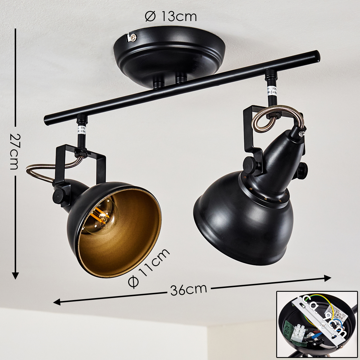 Schwarze Deckenleuchte mit zwei verstellbaren Strahlern und goldenen Innenseiten.