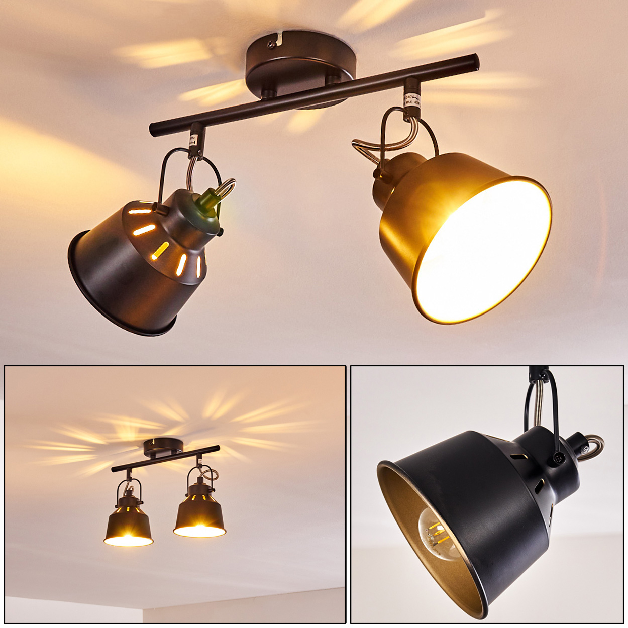 Zwei schwarze Deckenstrahler mit goldenen Innenseiten auf einer schwarzen Schiene.