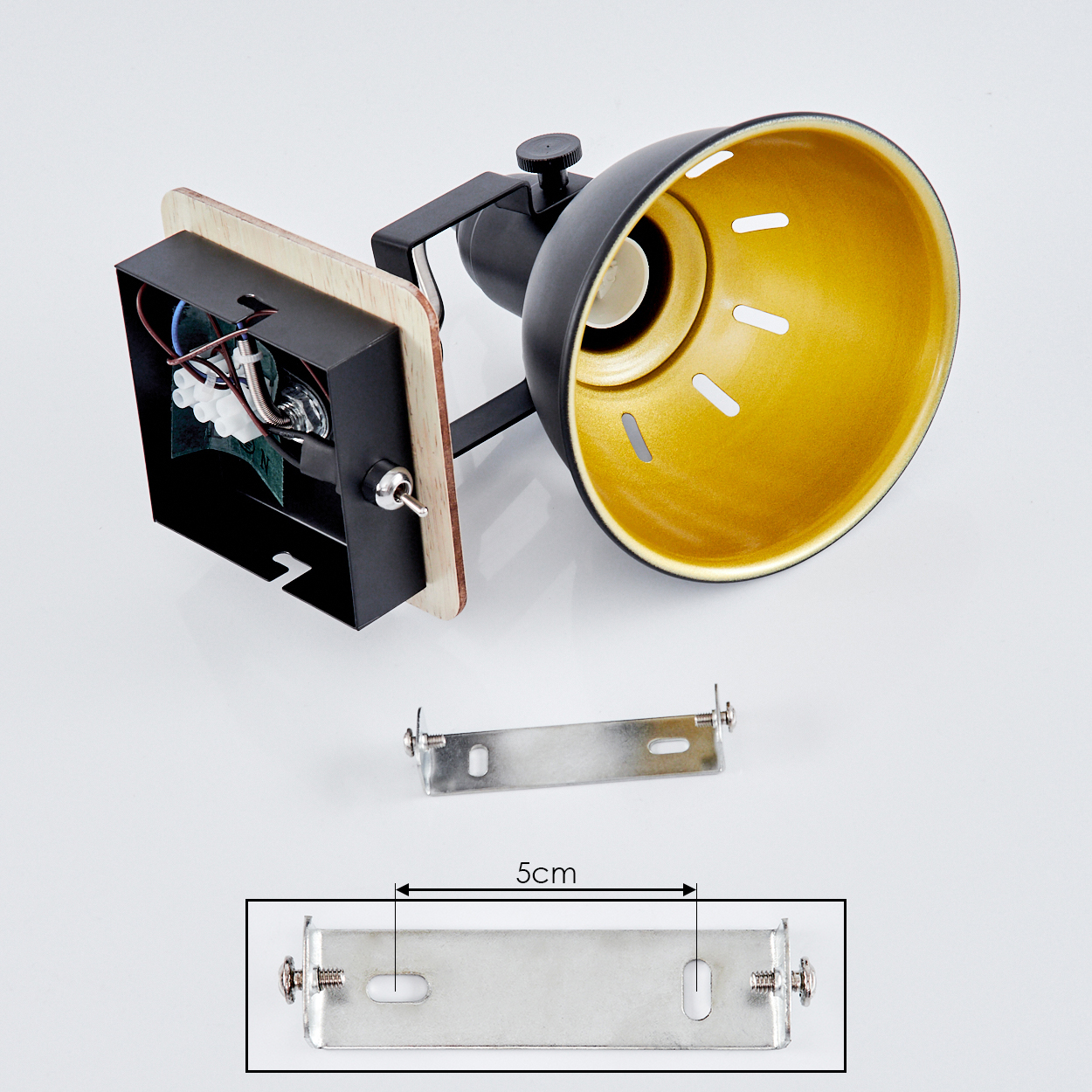 Schwarz-goldene Lampe mit freigelegten Drähten und Montagehalterung.