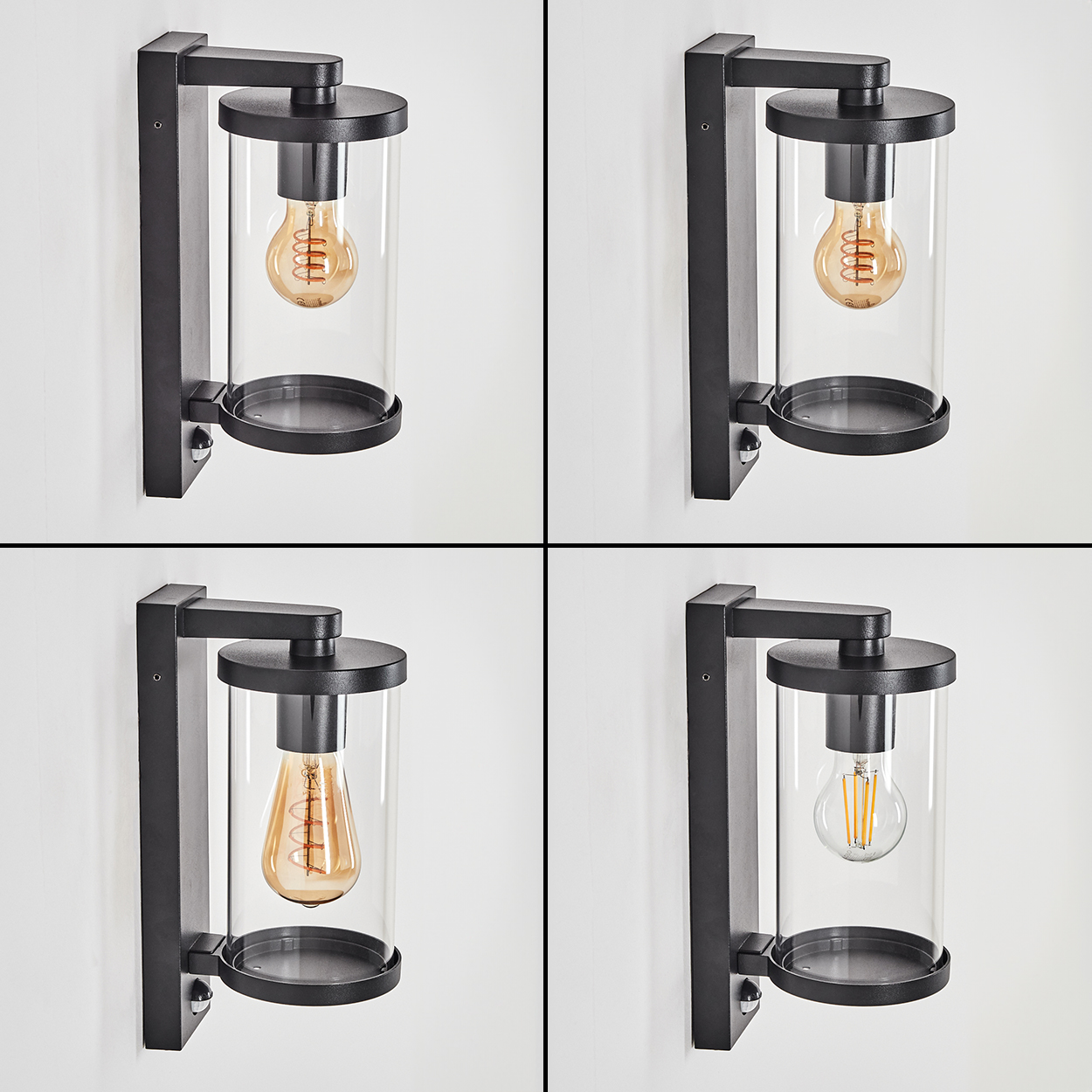 Vier schwarze Außenwandleuchten mit Glaszylindern und Edison-Glühbirnen.