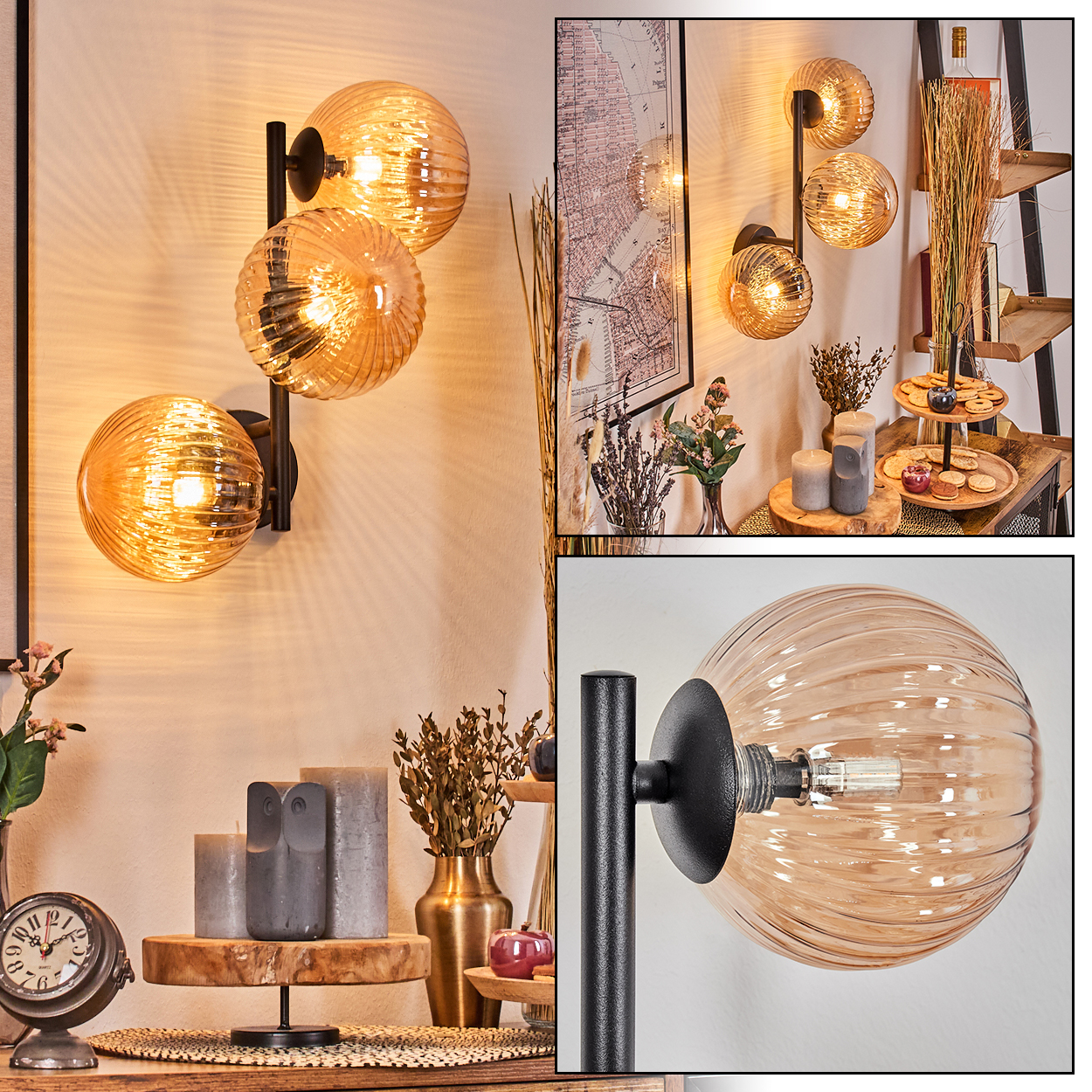 Eine moderne schwarze Wandlampe mit drei bernsteinfarbenen Glaskugeln, die warmes Licht wirft.