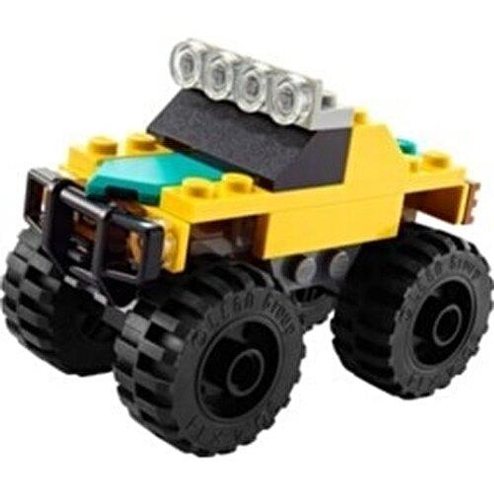 Un buggy Lego giallo con grandi ruote nere e quattro luci in cima.