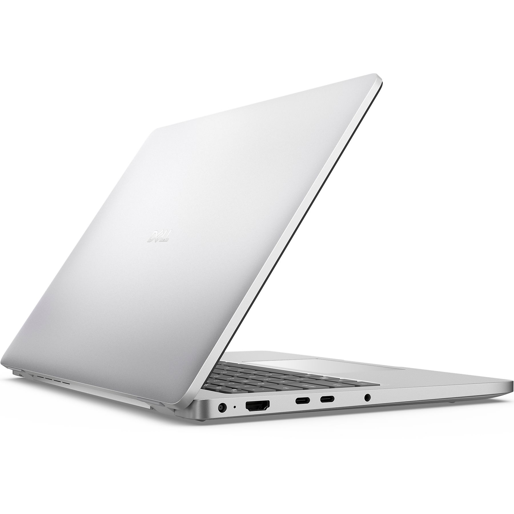 Un portátil Dell plateado está abierto sobre una superficie blanca.