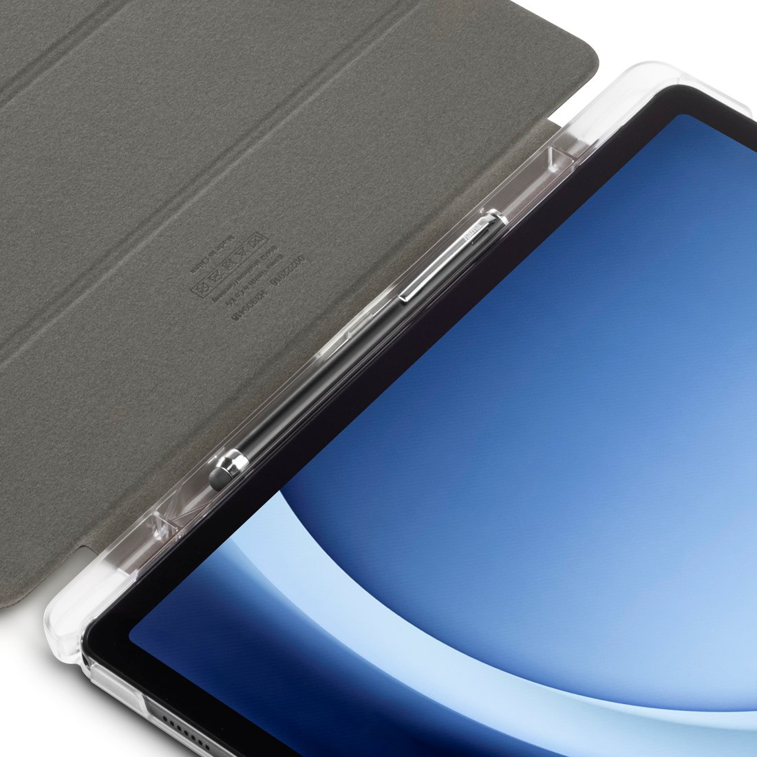 Tablet z szarą okładką i rysikiem.