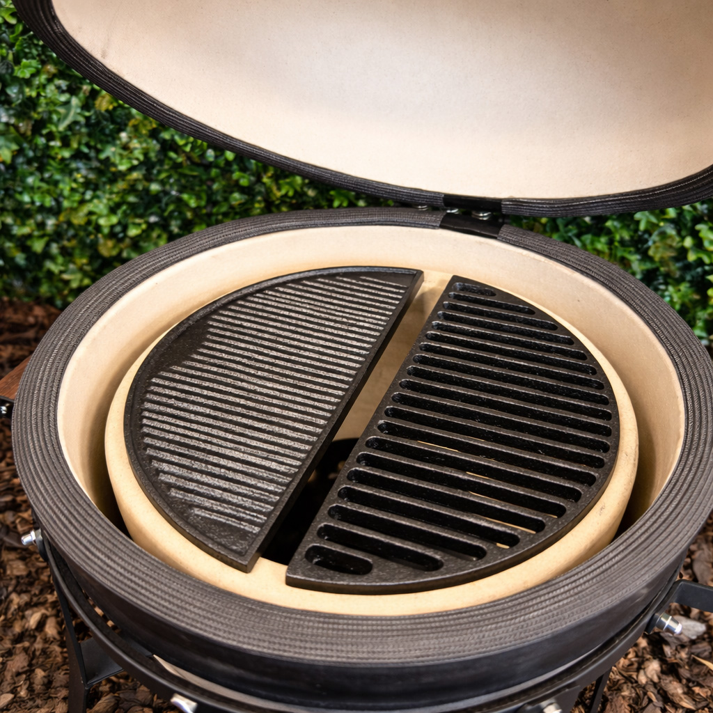 A ceramic grill with its lid open, featuring two half-round grates inside.