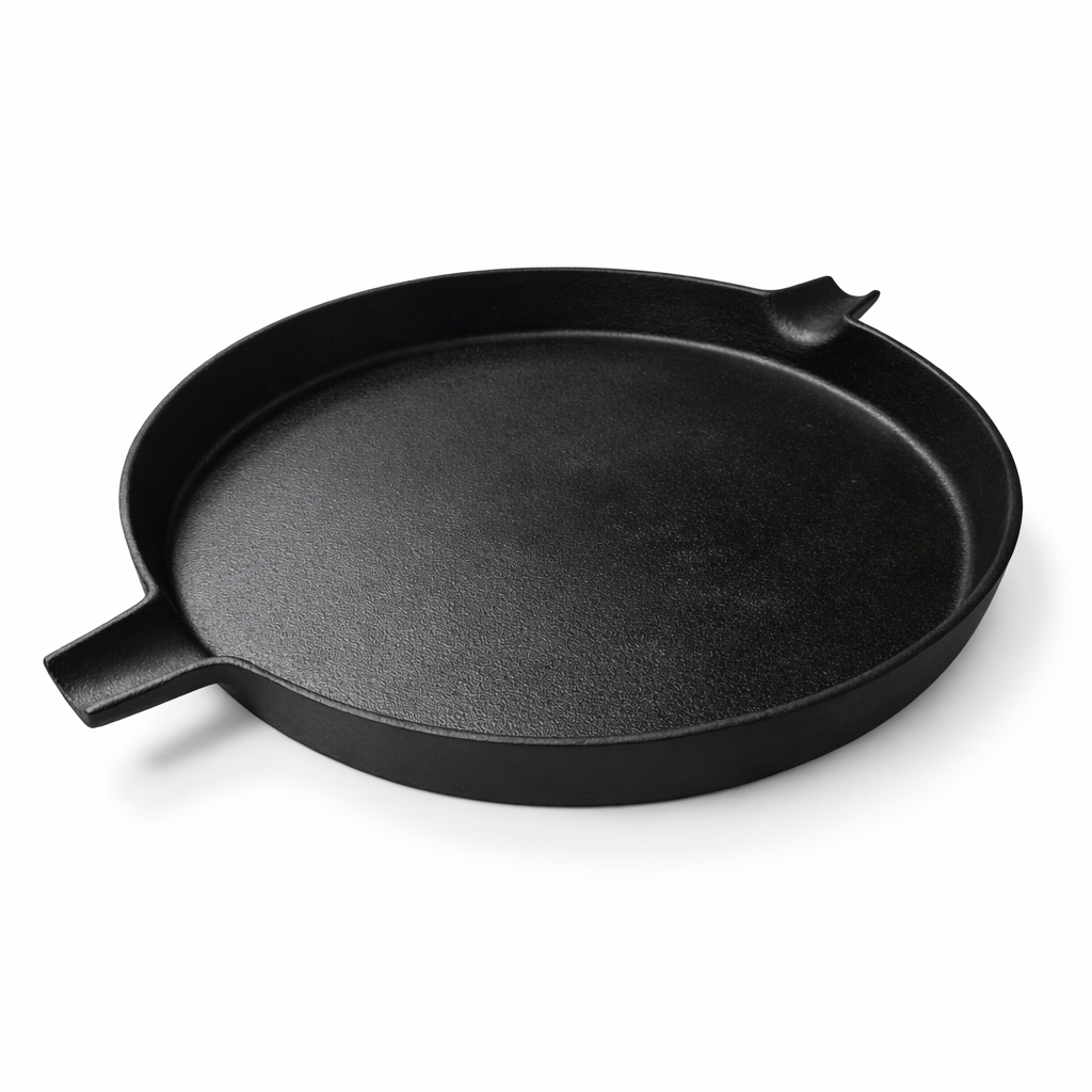 A black, round cast iron pan with two handles, on a white background.