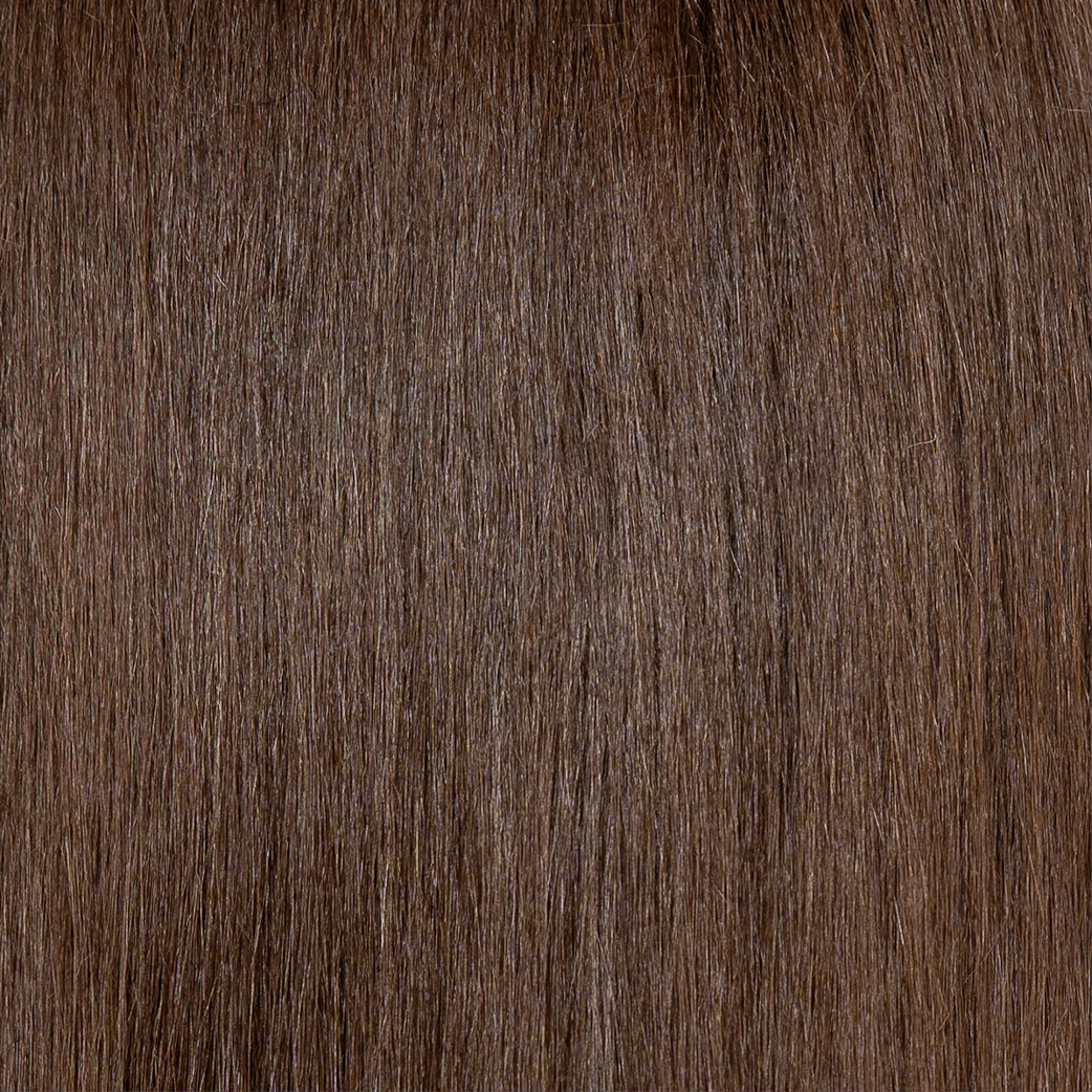 A close-up shot of smooth, dark brown hair.