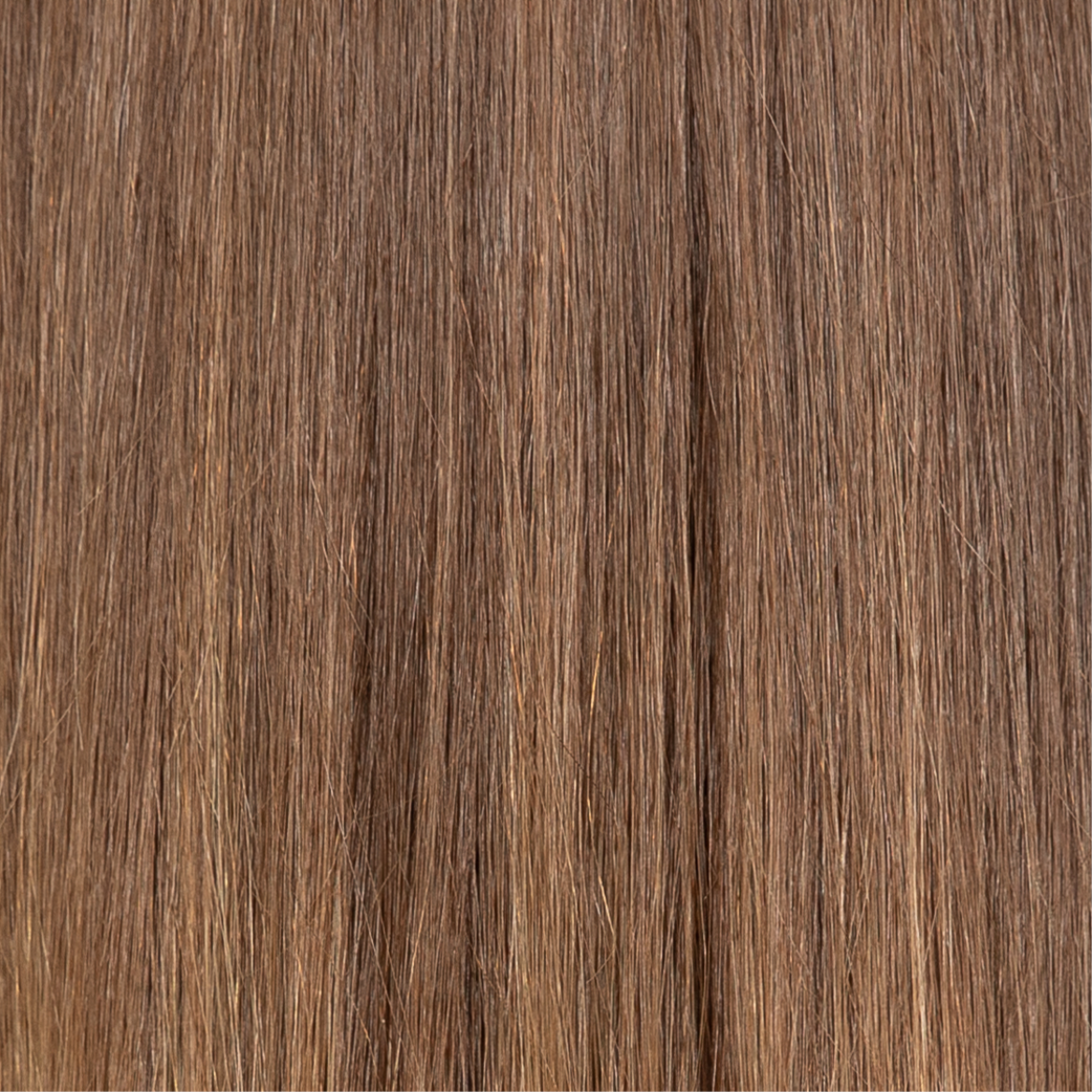 Fine, straight, brown hair with lighter strands.