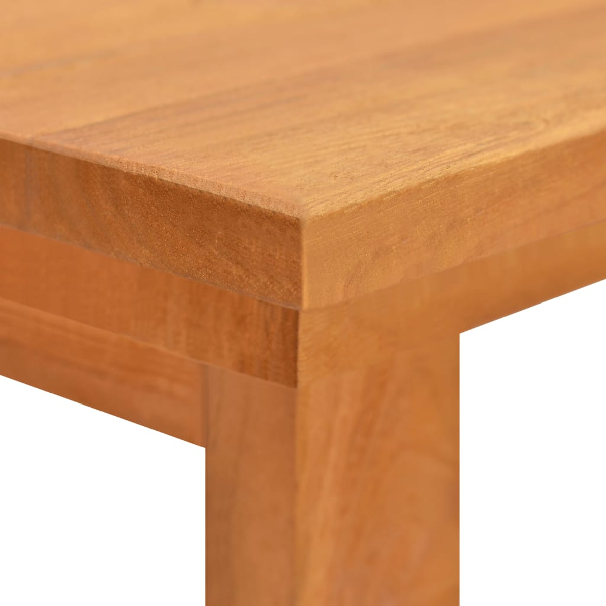Nahaufnahme einer Holztischkante mit sichtbarer Maserung und Beine.