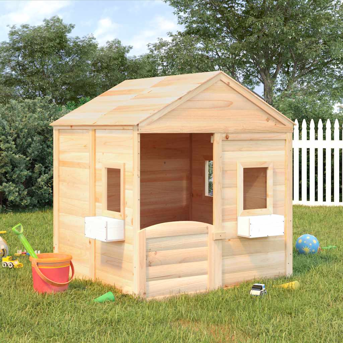 Una casa giochi in legno si trova sull'erba con giocattoli, alberi e una recinzione bianca.