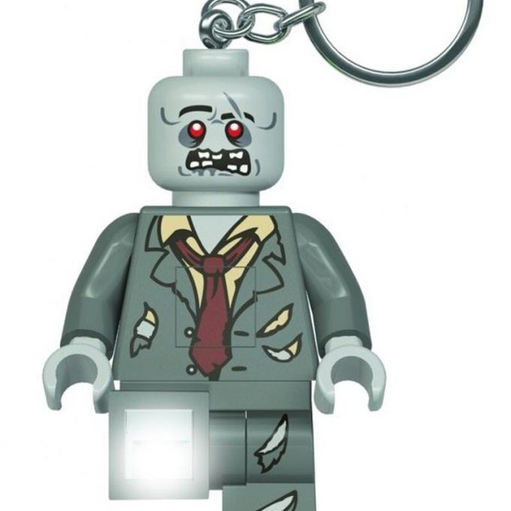 Kırmızı kravatlı ve parlayan ön parçalı gri Lego zombi anahtarlığı.