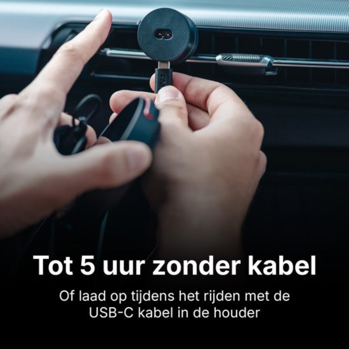 A person connects a USB-C cable to a black mount on a car air vent.