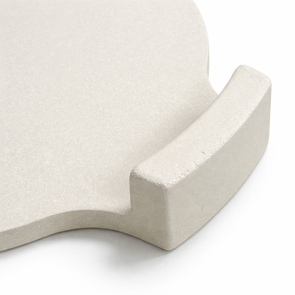 A cream-colored pizza stone with a handle on a white background.