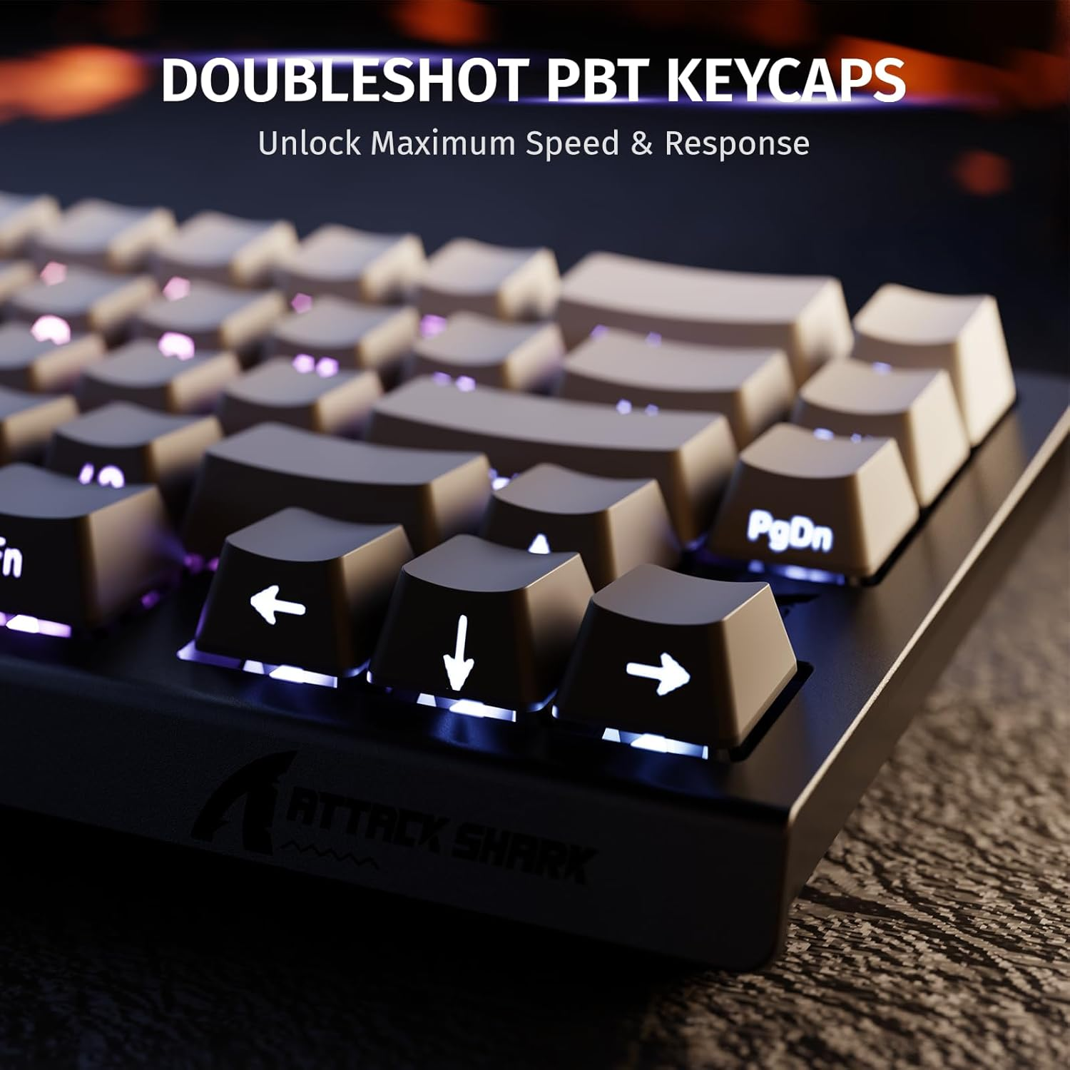 Close up of a backlit keyboard with dark keycaps and a logo.
