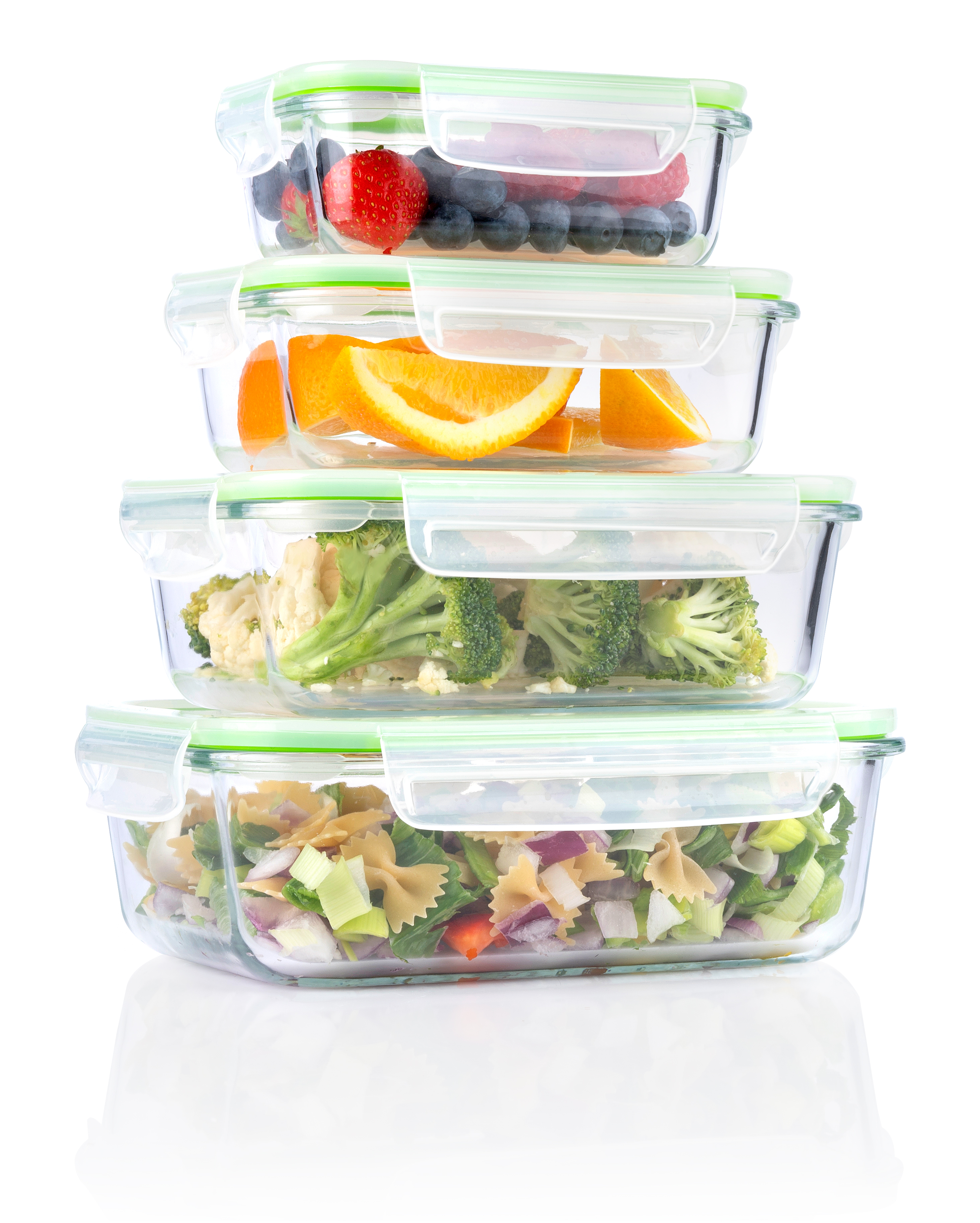 Four glass containers with food: berries, oranges, vegetables, pasta salad.