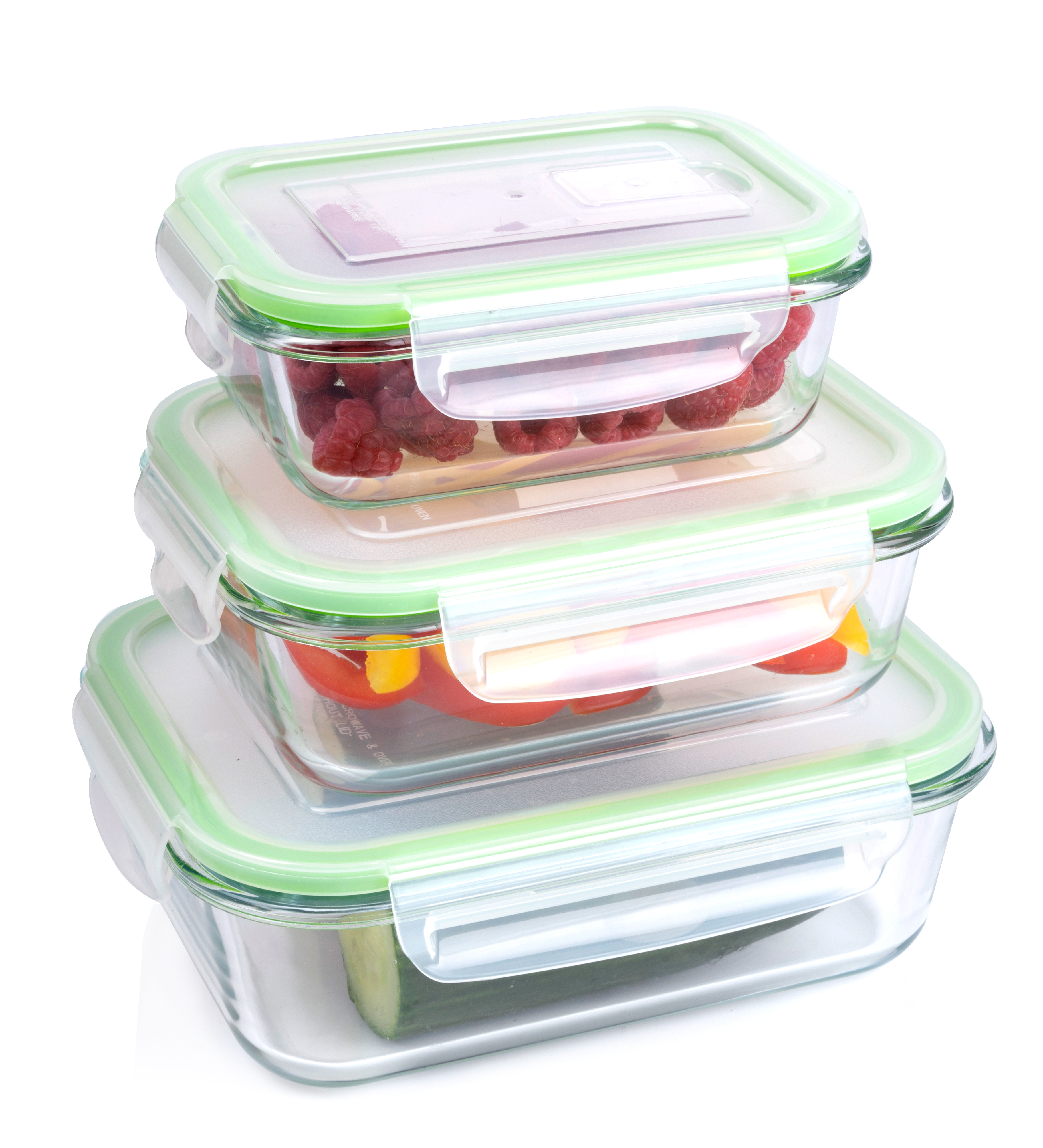 Three glass food containers with green lids, stacked. Filled with berries, peppers, and cucumber.