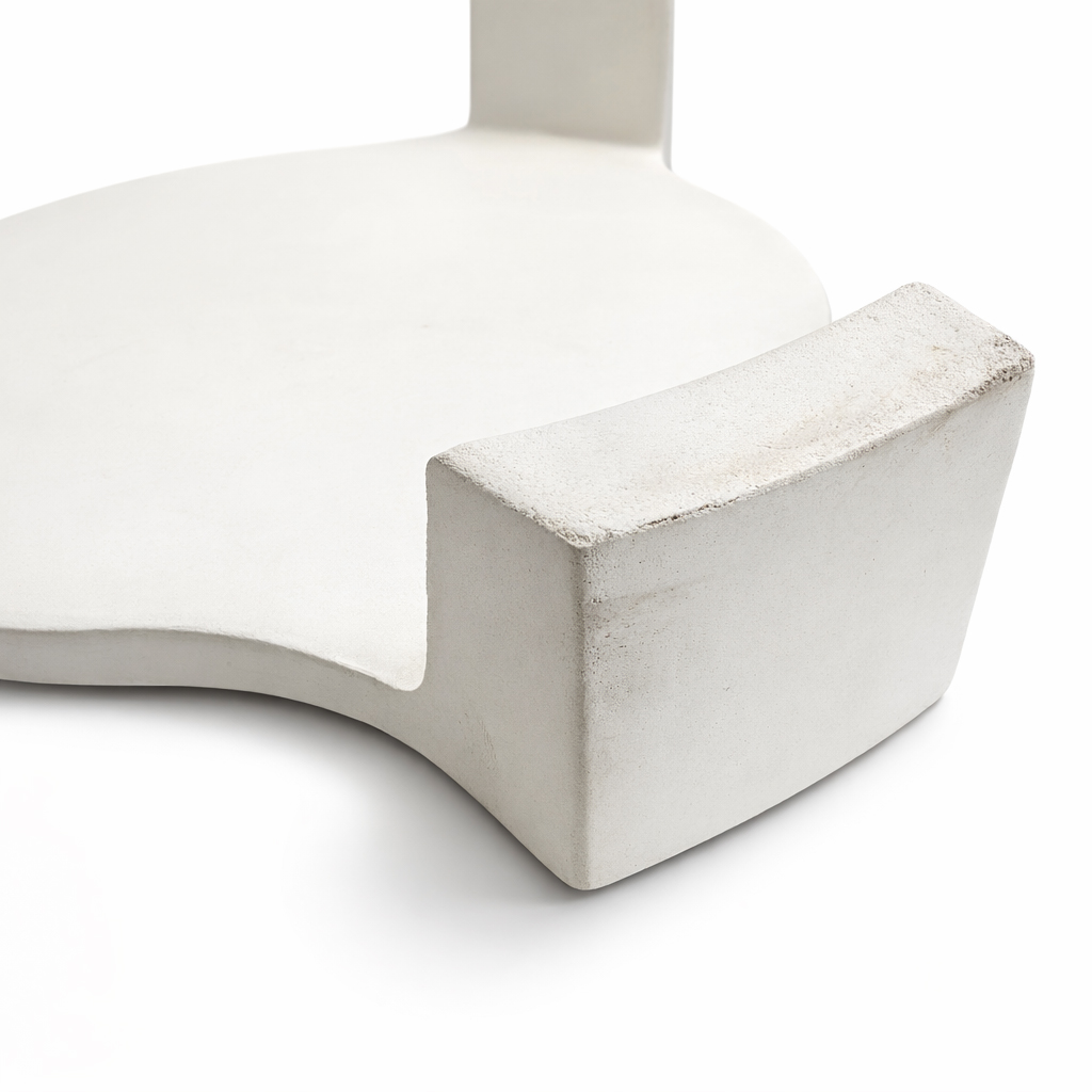 A white, modern pedestal with a rounded edge and a corner.