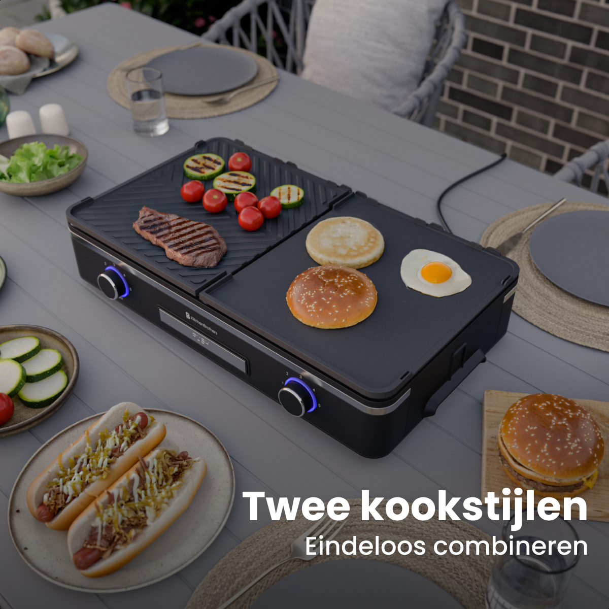 An electric grill with steak, vegetables, buns, and egg. Hot dogs and a burger nearby.