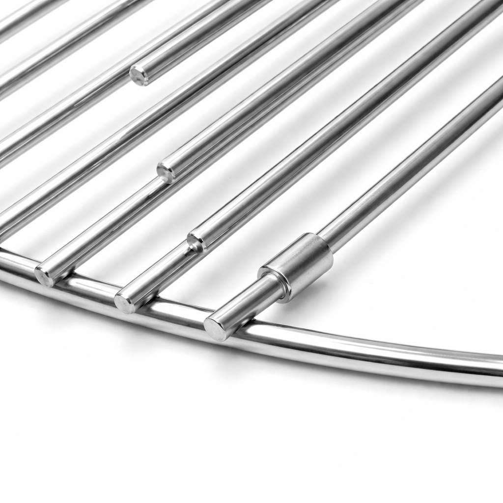 Close-up of a round metal grill with parallel bars on a white background.
