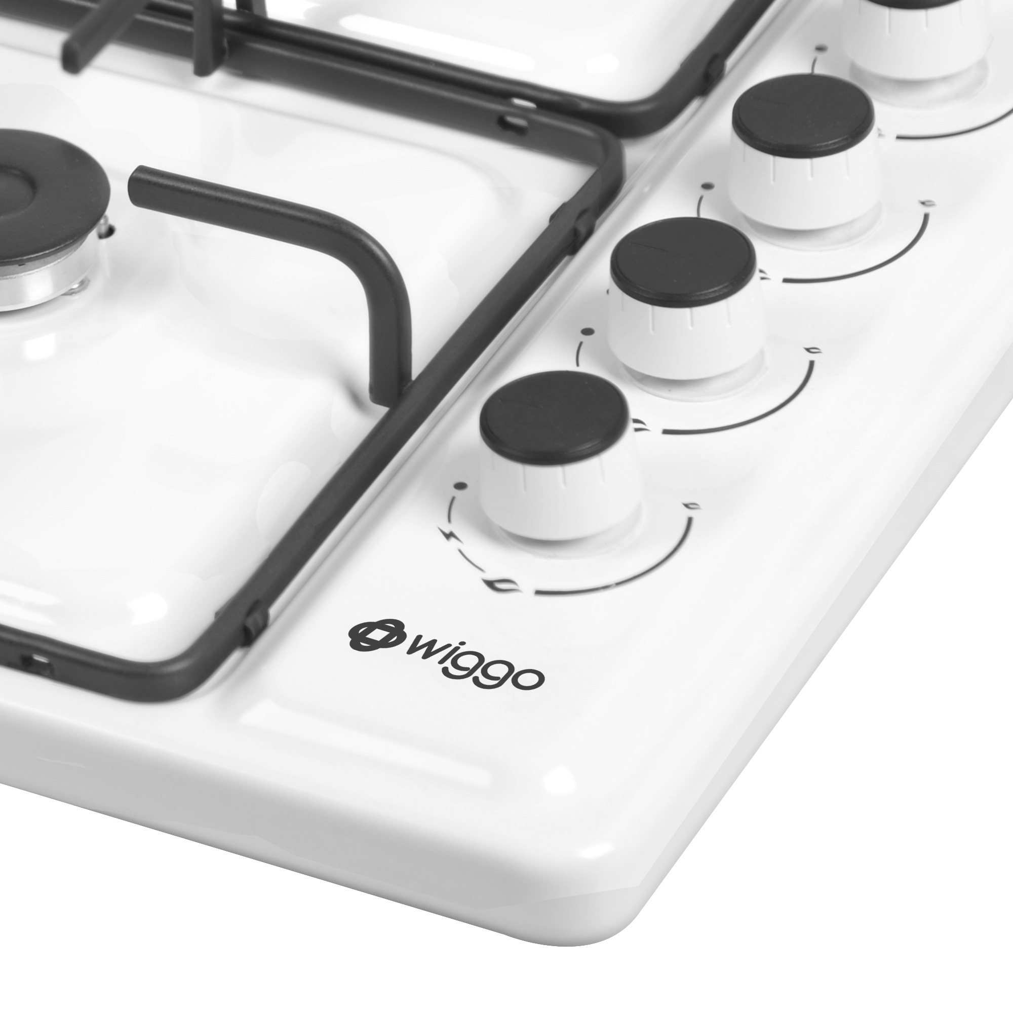 Close-up of a white gas hob with black knobs and grates.