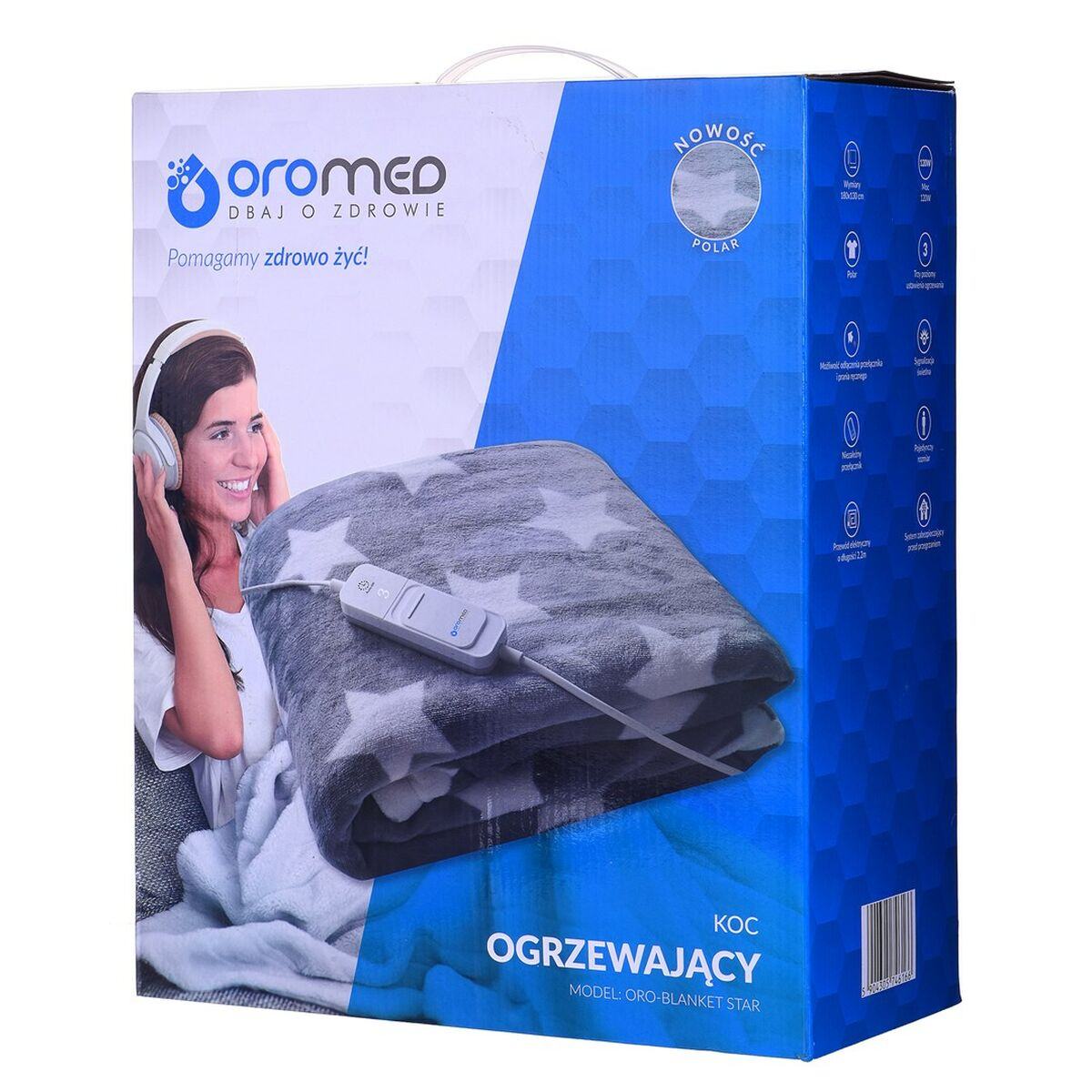 Una donna con cuffie sorride accanto a una coperta a stelle con controller.
