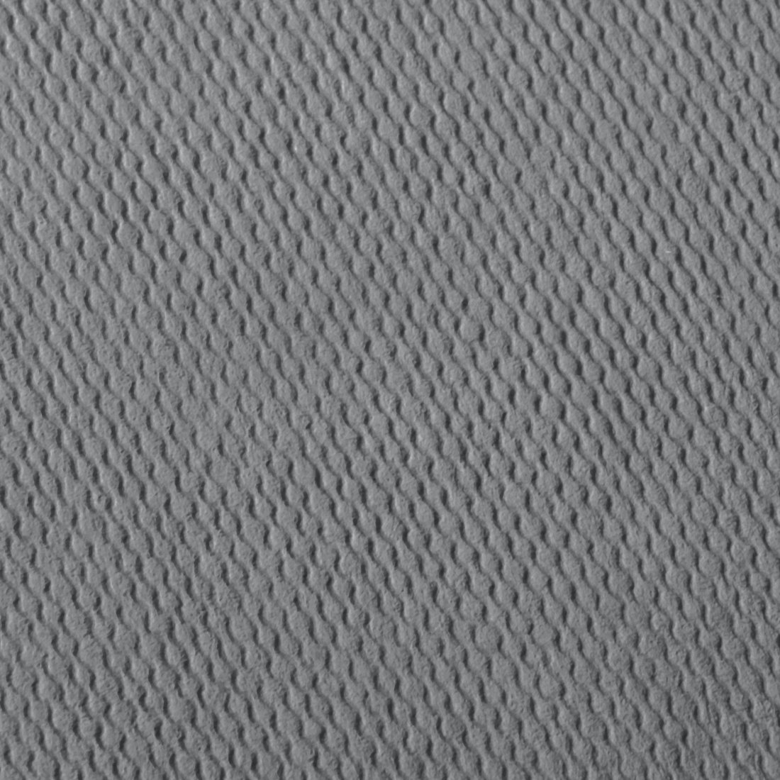 Szara teksturowana powierzchnia z falistym wzorem wypukłych linii.