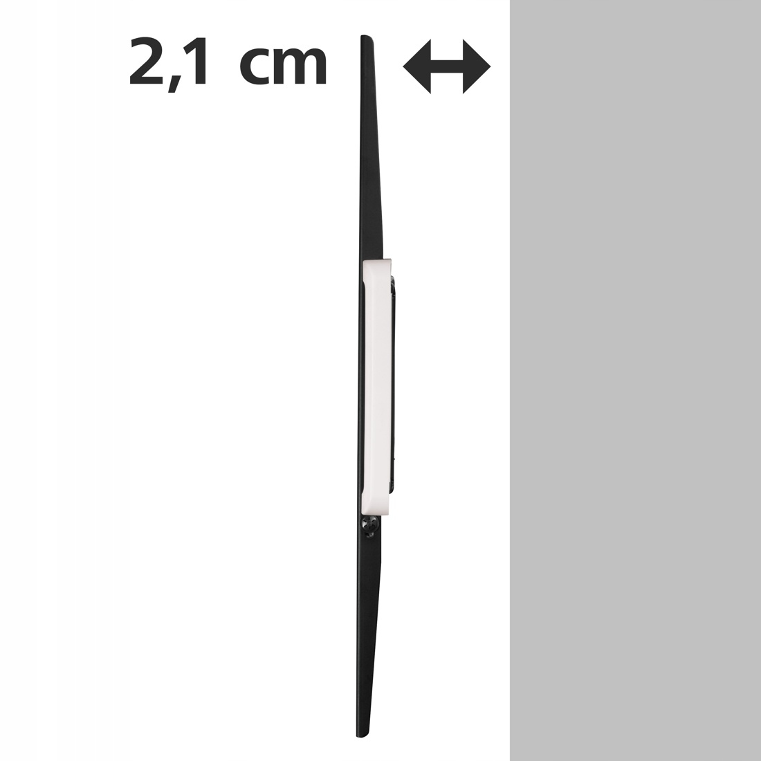 Widok z boku czarnego urządzenia o grubości 2,1 cm ze znakiem strzałki.