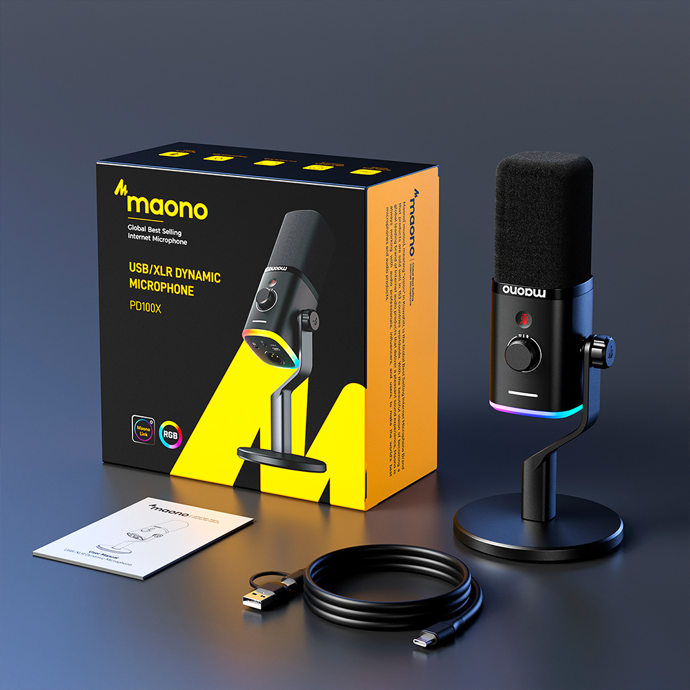 Maono PD100X microfoon met doos, kabel en handleiding op donkere achtergrond.