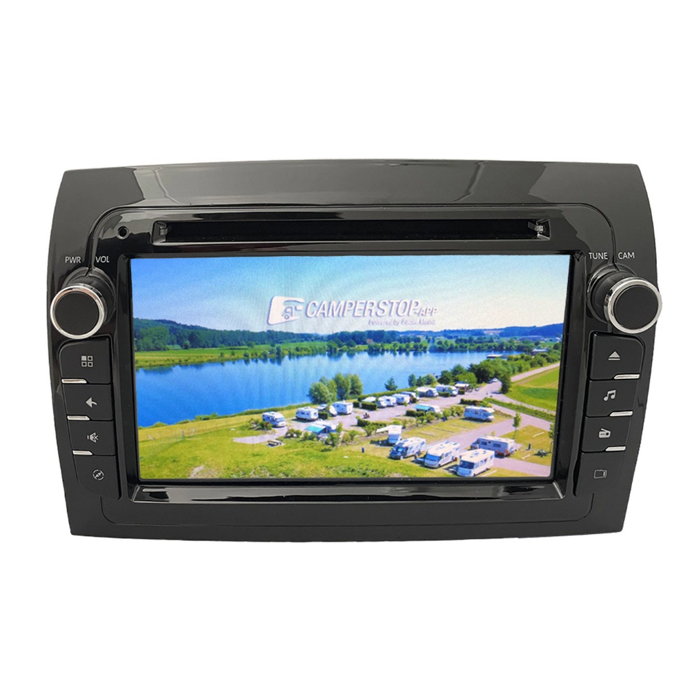 A car stereo displays a campsite scene with a lake and trees.