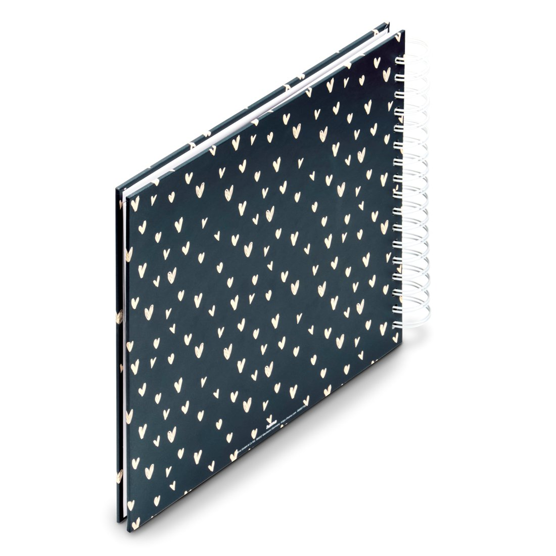 Granatowy notatnik z białym wzorem serc i spiralnym grzbietem.