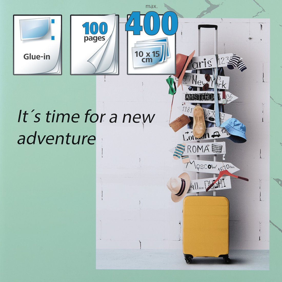 Żółta walizka ze znakami kierunkowymi i tekstem o przygodzie.