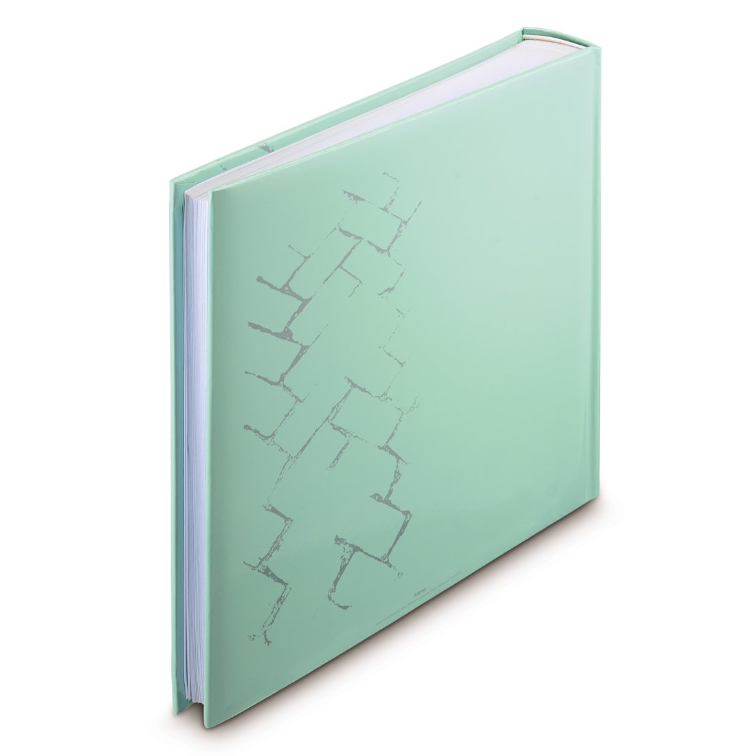 Miętowo-zielony album z szarym wzorem cegieł tworzącym linie ukośne.