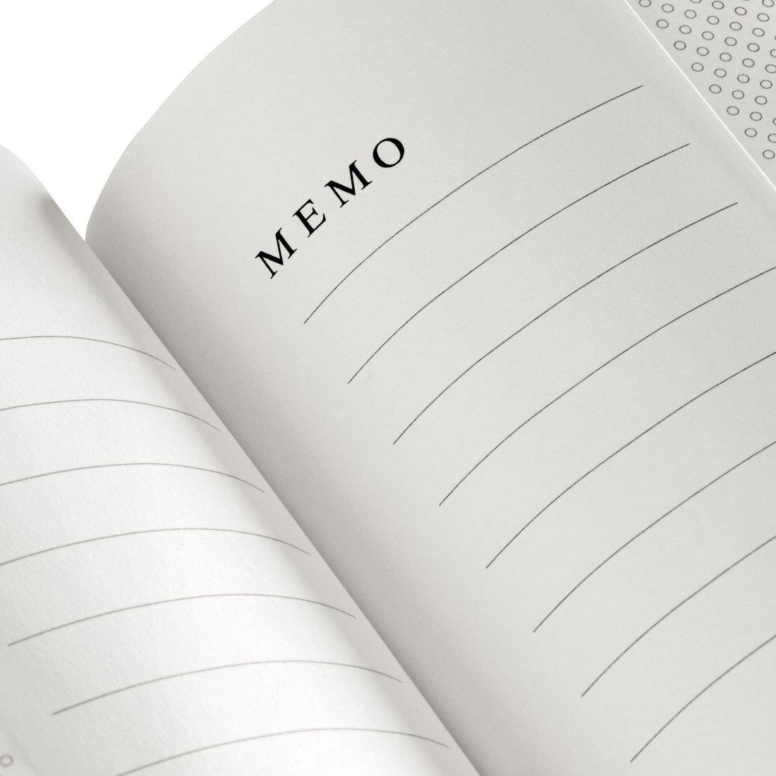 Otwarty notatnik ze słowem „MEMO” i pustymi liniami.